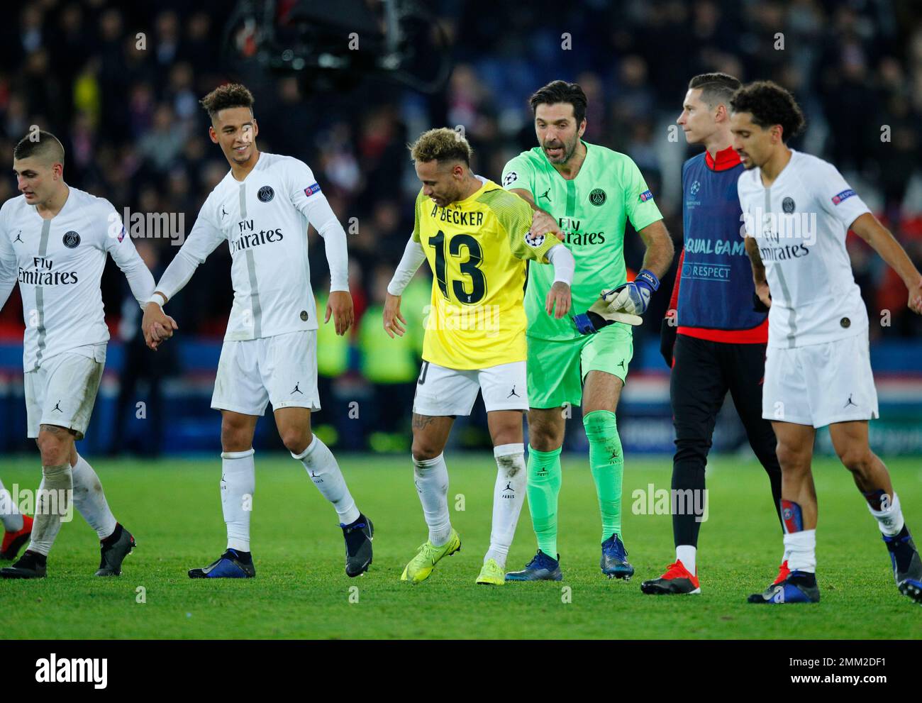 PSG forward Neymar, wearing the t-shirt of Liverpool goalkeeper Alisson  celebrates with PSG goalkeeper Gianluigi Buffon after the Champions League  Group C soccer match between Paris Saint Germain and Liverpool at the