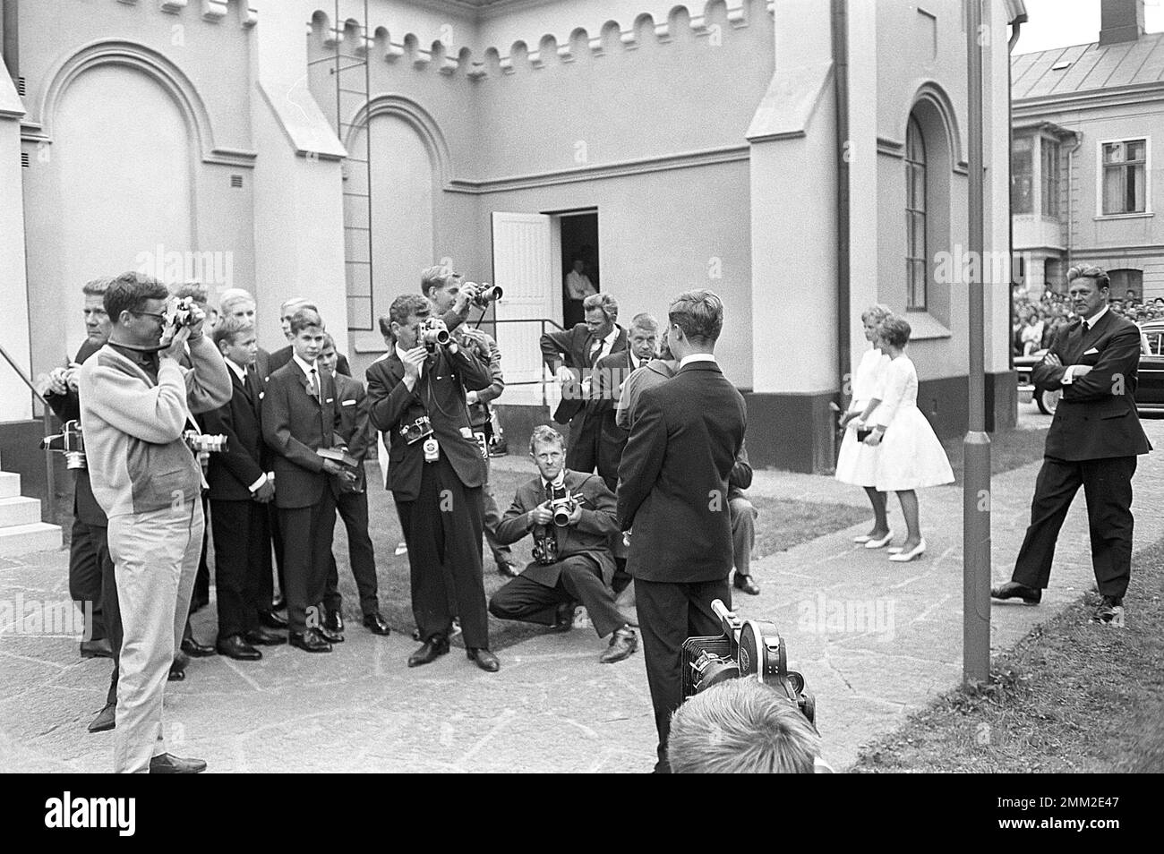 Carl XVI Gustaf, King of Sweden. Born 30 april 1946. Picture taken in connection with his confirmation 21 july 1962 at Borgholms church on the island of Öland. The pressphotographers are seen taking pictures. ref SC1020 Stock Photo