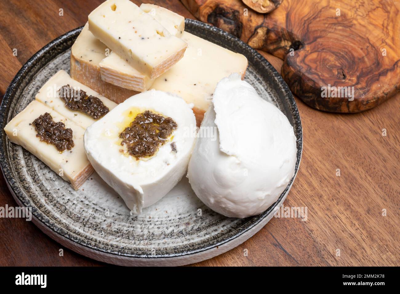 Italian cheese collection, yellow taleggio cheese and white mozzarella