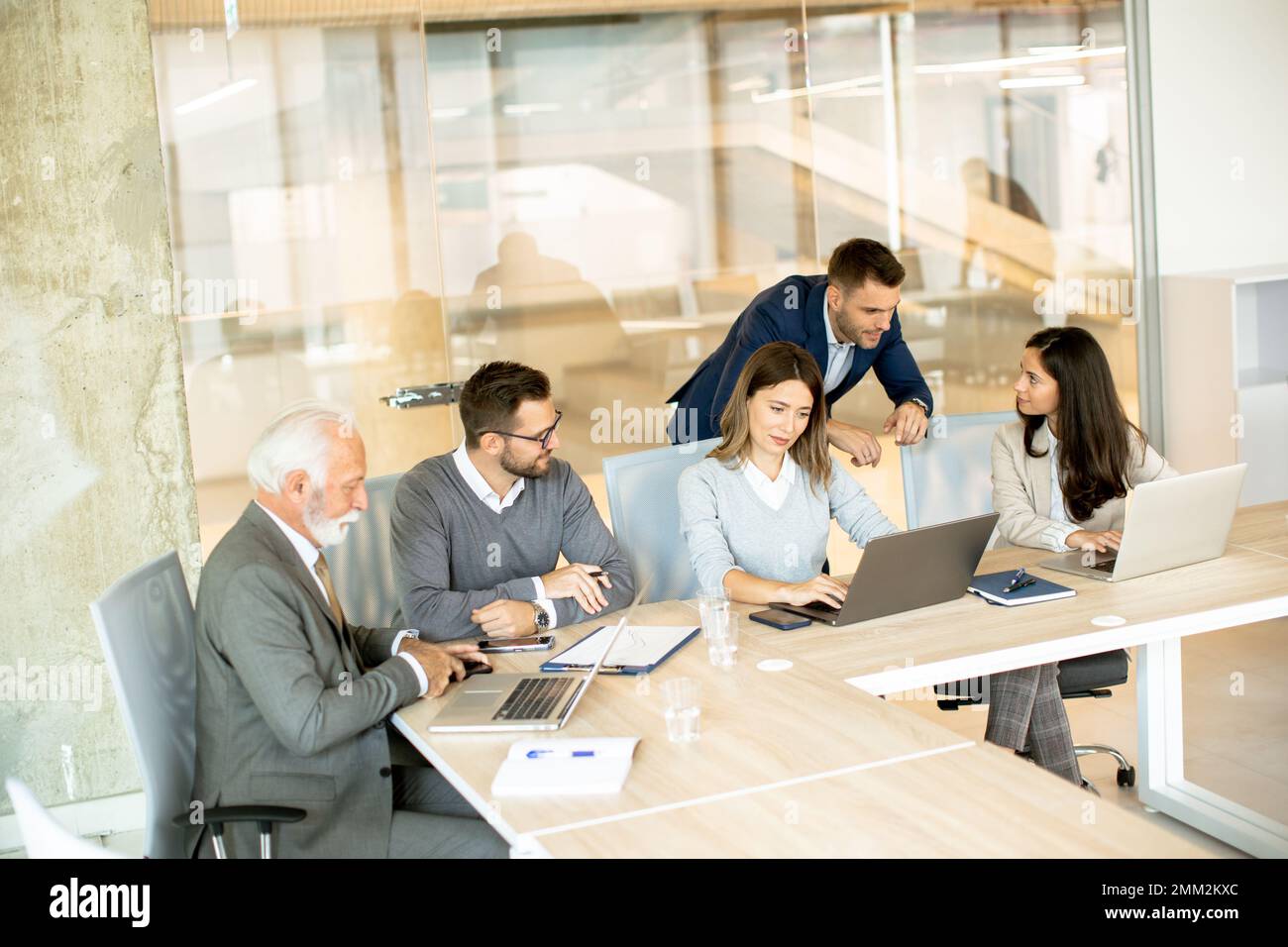 Group of businessmen and businesswomen working together in office Stock Photo