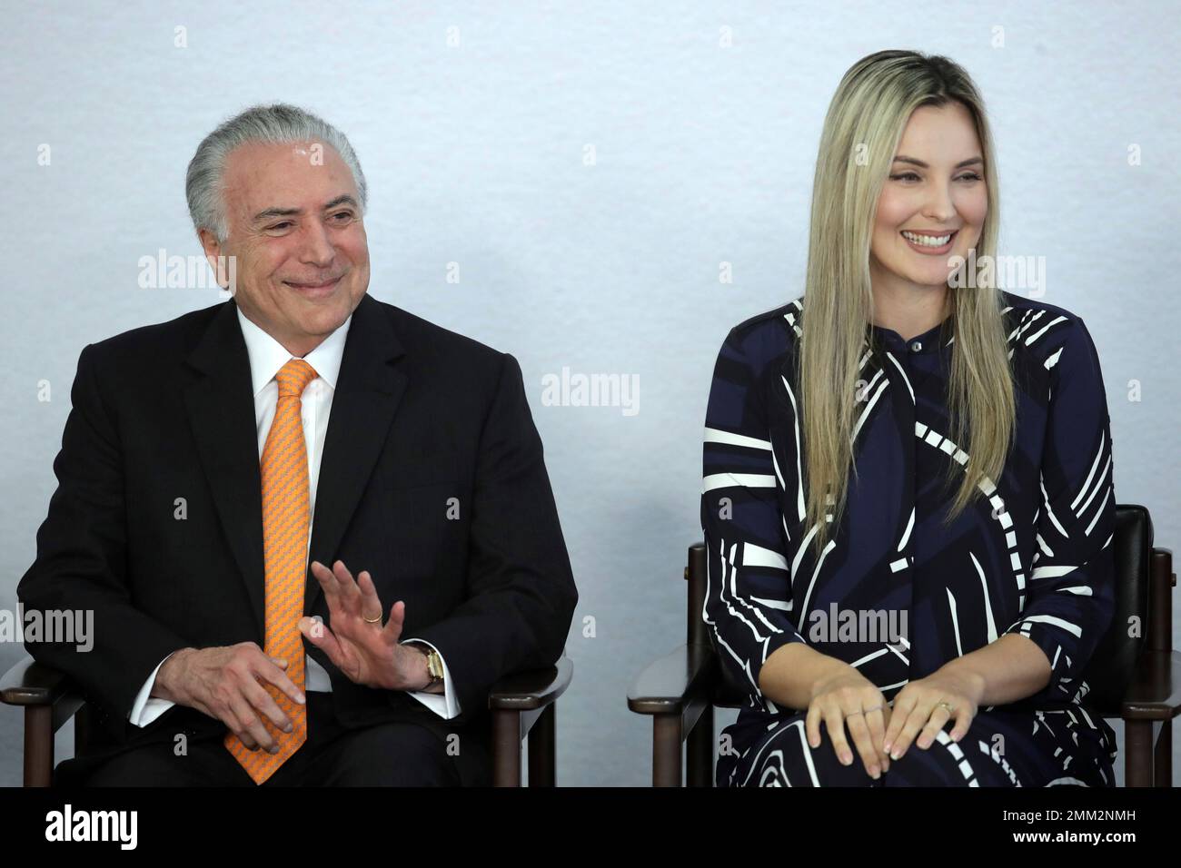 Brazil's President Michel Temer and his wife Marcela Temer, smile at a ceremony to launch the National Plan to Combat Domestic Violence against Women, at the Planalto Presidential Palace, in Brasilia, Brazil, Tuesday, Nov. 27, 2018. (AP Photo/Eraldo Peres) Stock Photo
