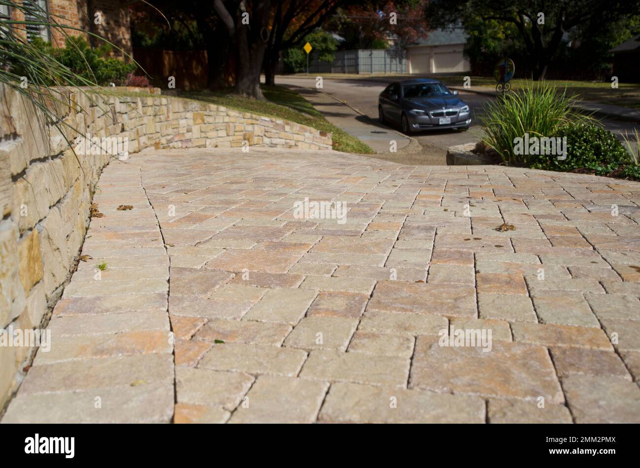 This Nov. 24, 2018 photo shows a stone pavers driveway in a residential neighborhood in Dallas