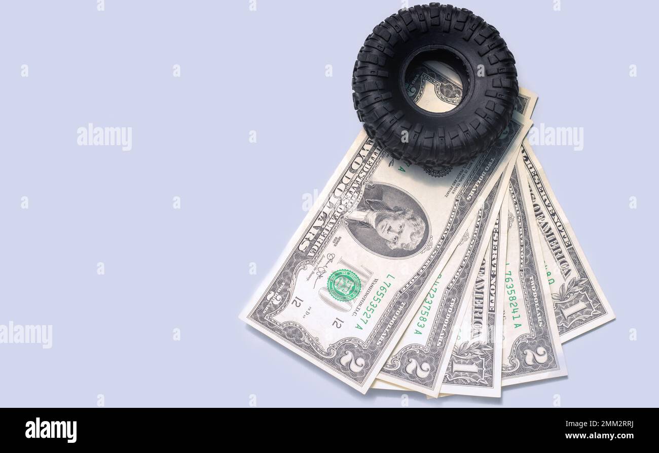 tire replacement change concept.black tires plastic wrench key dollar