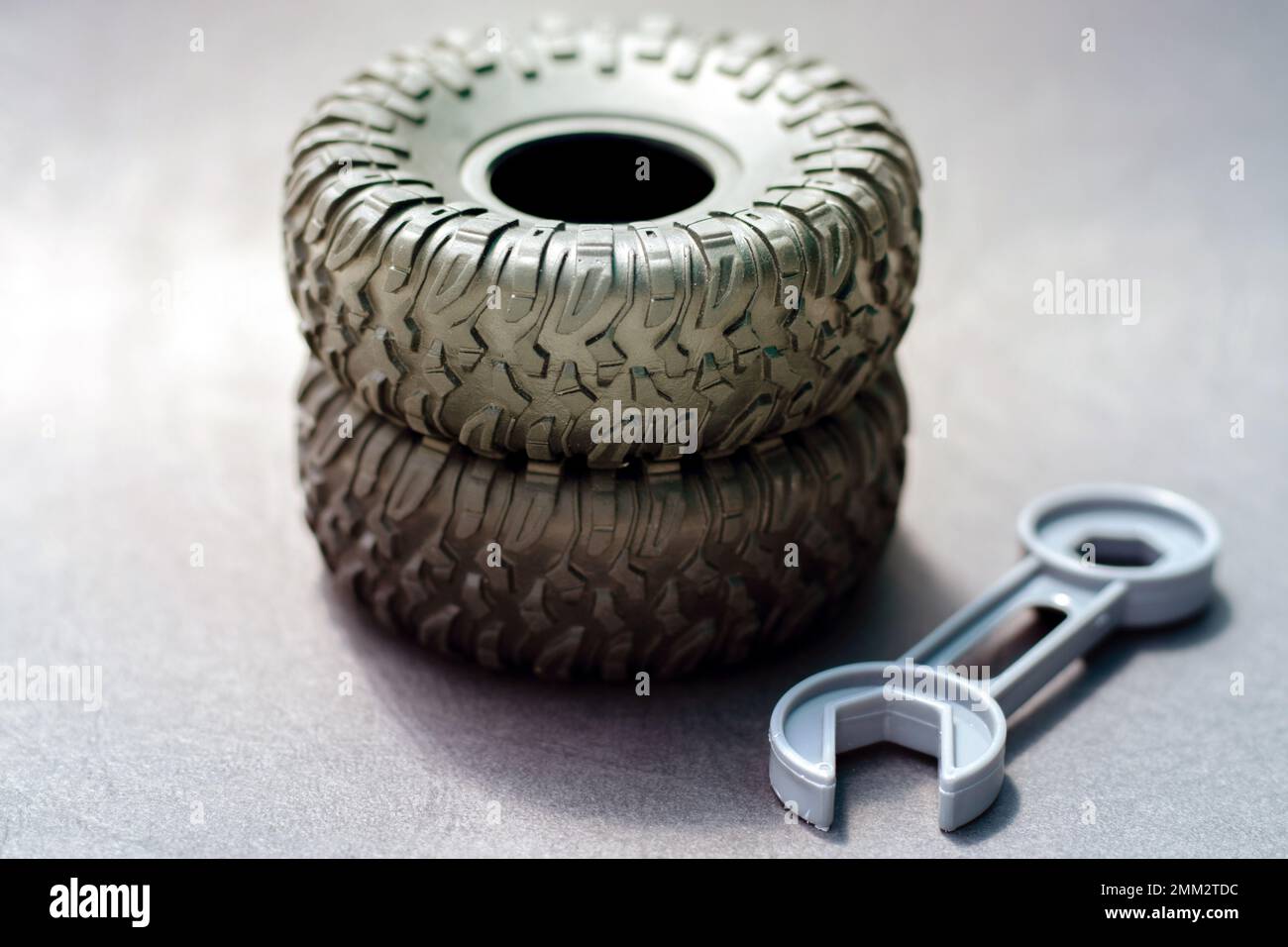 tire replacement change concept.black tires plastic wrench key dollar