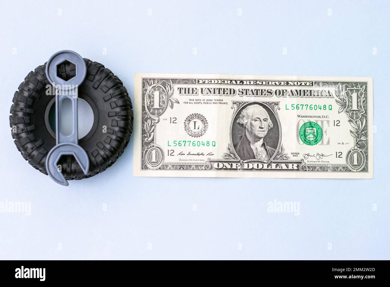 tire replacement change concept.black tires plastic wrench key dollar