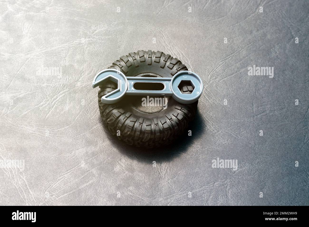 tire replacement change concept.black tires plastic wrench key dollar