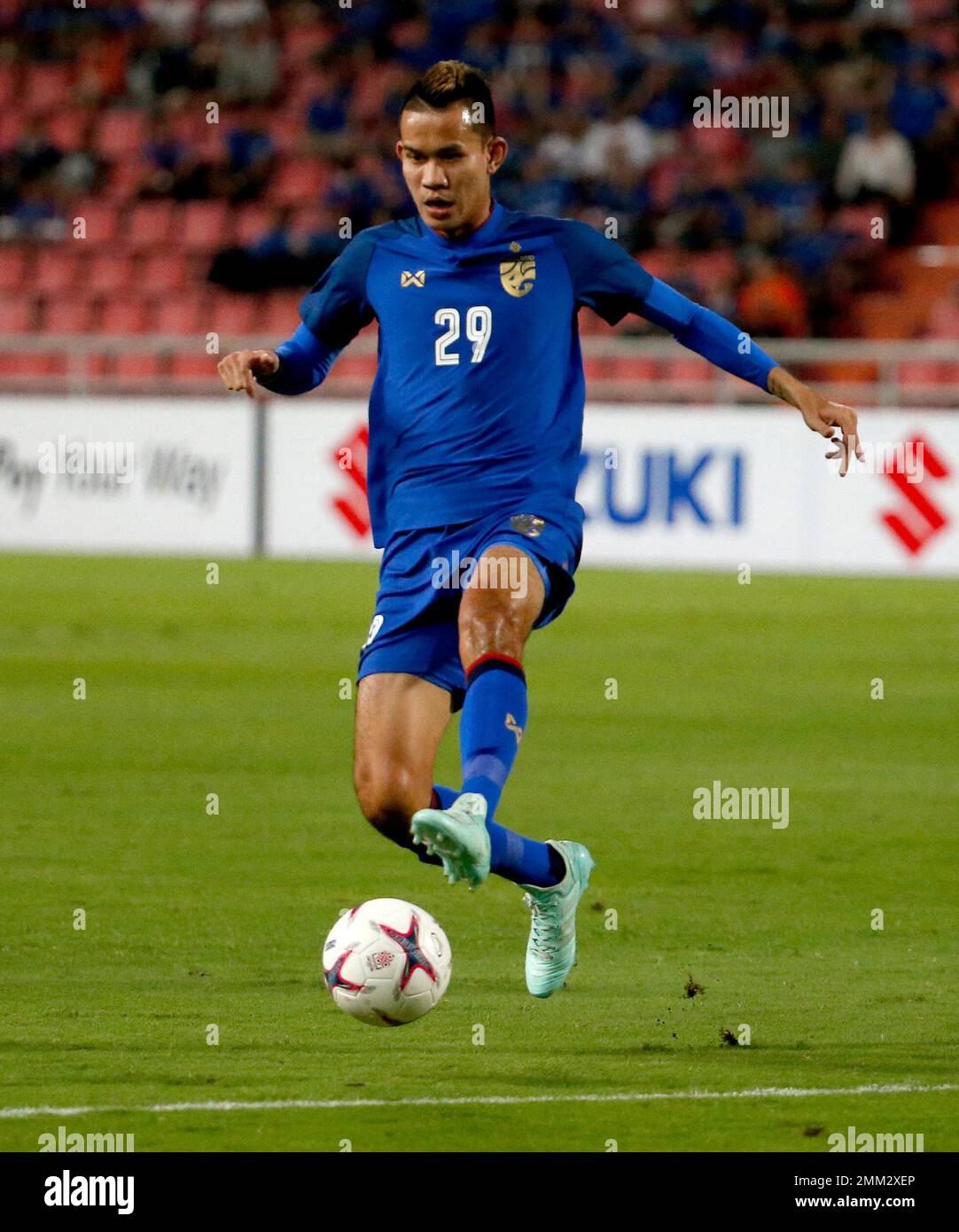 Thailand's Sanrawat Dechmitr controls the ball during their AFF Suzuki