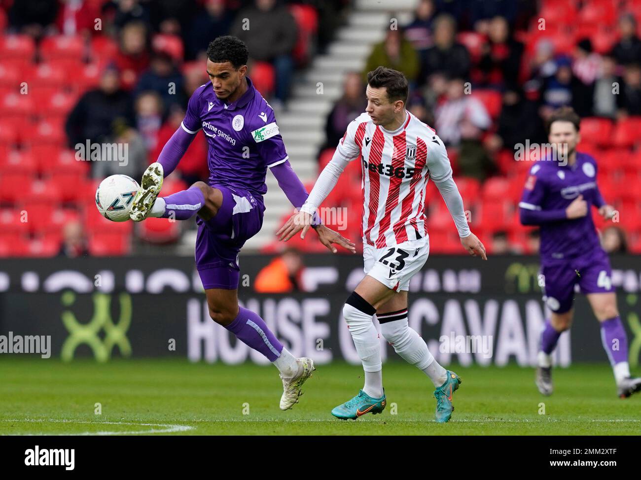 Stoke, UK. 29th Jan, 2023. Terence Vancooten of Stevenage challenged by Bersant Celina of Stoke City during the The FA Cup match at The Bet365 Stadium, Stoke. Picture credit should read: Andrew Yates/Sportimage Credit: Sportimage/Alamy Live News Stock Photo