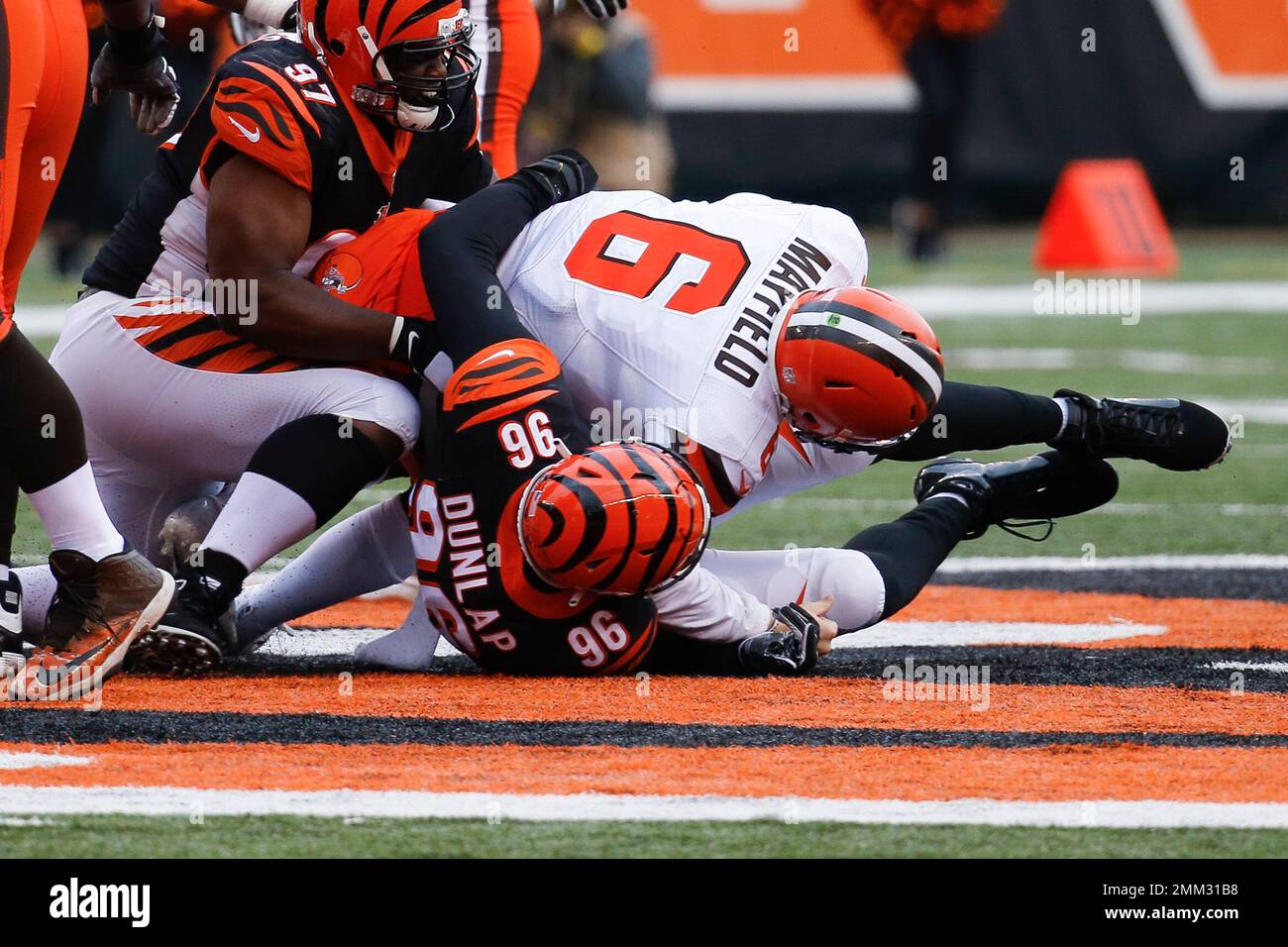 Cleveland Browns quarterback Baker Mayfield 6 is sacked by Cincinnati Bengals defensive end Carlos Dunlap 96