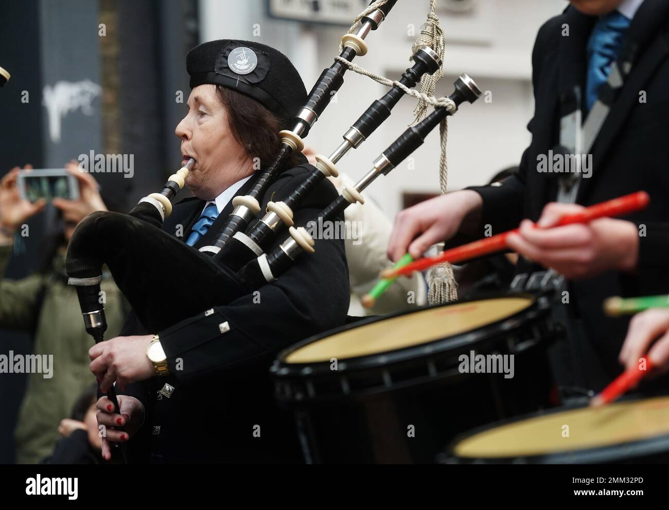 A member of the Clew Bay Pipe Band as they march through the streets of Temple Bar, Dublin, as part of TradFest Temple Bar 2023. Ireland's largest trad and folk music festival TradFest ran from January 25th to 29th with over 85 concerts, 50 of which are free. Picture date: Sunday January 29, 2023. Stock Photo