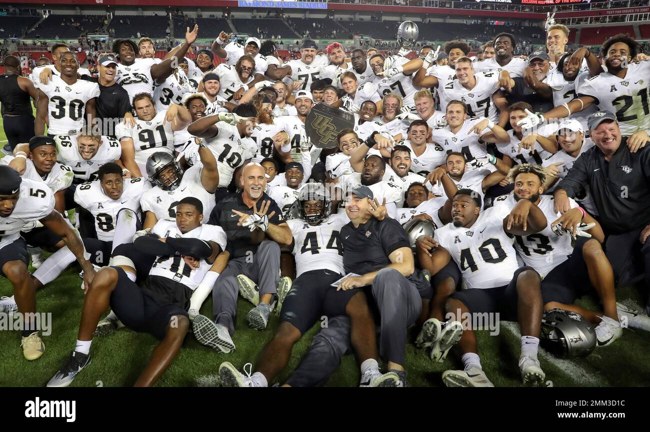 Central Florida celebrates with the War on I-4 trophy after defeating ...