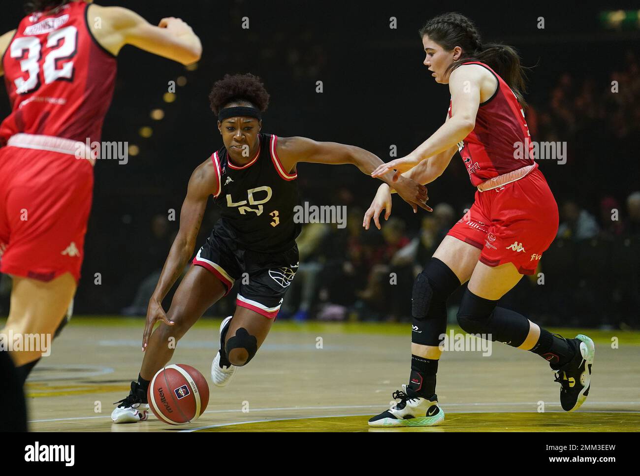 London Lions' Shanice BeckfordNorton drives to the basket past