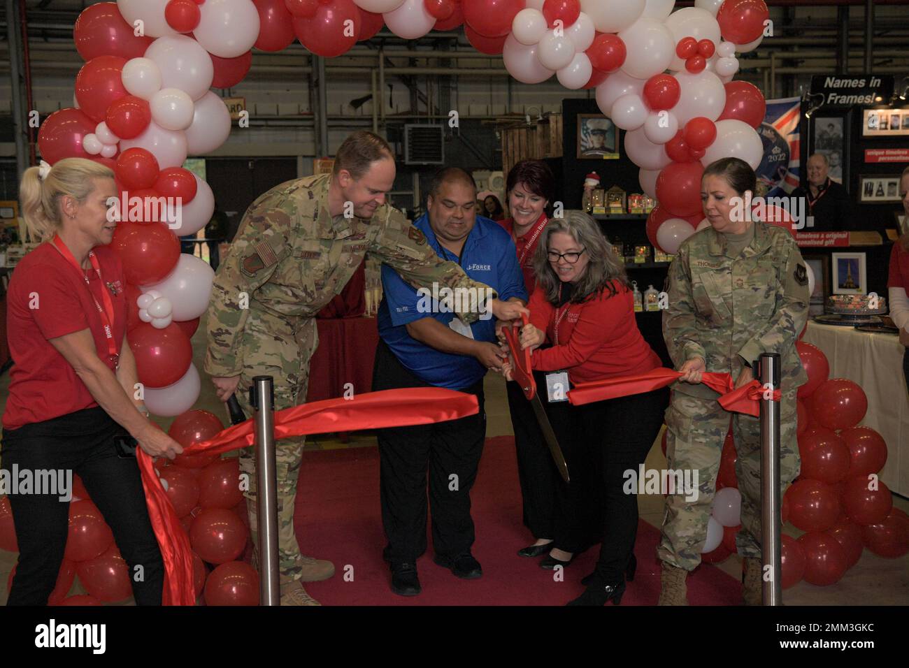 Volunteers and service members from the 86th Airlift Wing cut the ribbon officially opening the 58th Annual Ramstein Bazaar at Ramstein Air Base, Germany, Sept. 14, 2022. The four-day annual event includes more than 120 vendors from throughout Europe. Stock Photo