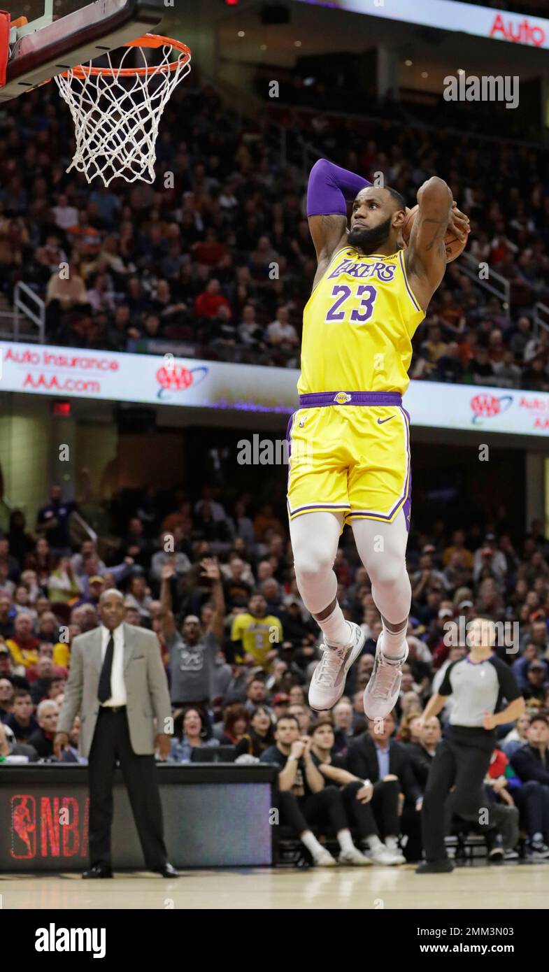 Los Angeles Lakers' LeBron James goes up for a dunk against the Cleveland  Cavaliers during the second half of an NBA basketball game Wednesday, Nov.  21, 2018, in Cleveland. The Lakers won