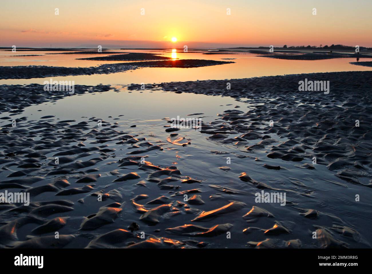 Sands flats exposed at low tide at West Wittering, West Sussex, UK. Stock Photo