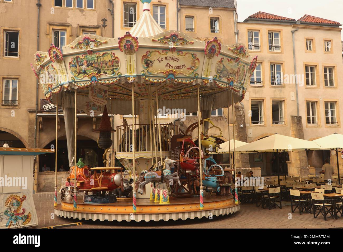 merry-go-round on square called Place Saint-Louis in french city Metz, France, August 30 2022 Stock Photo
