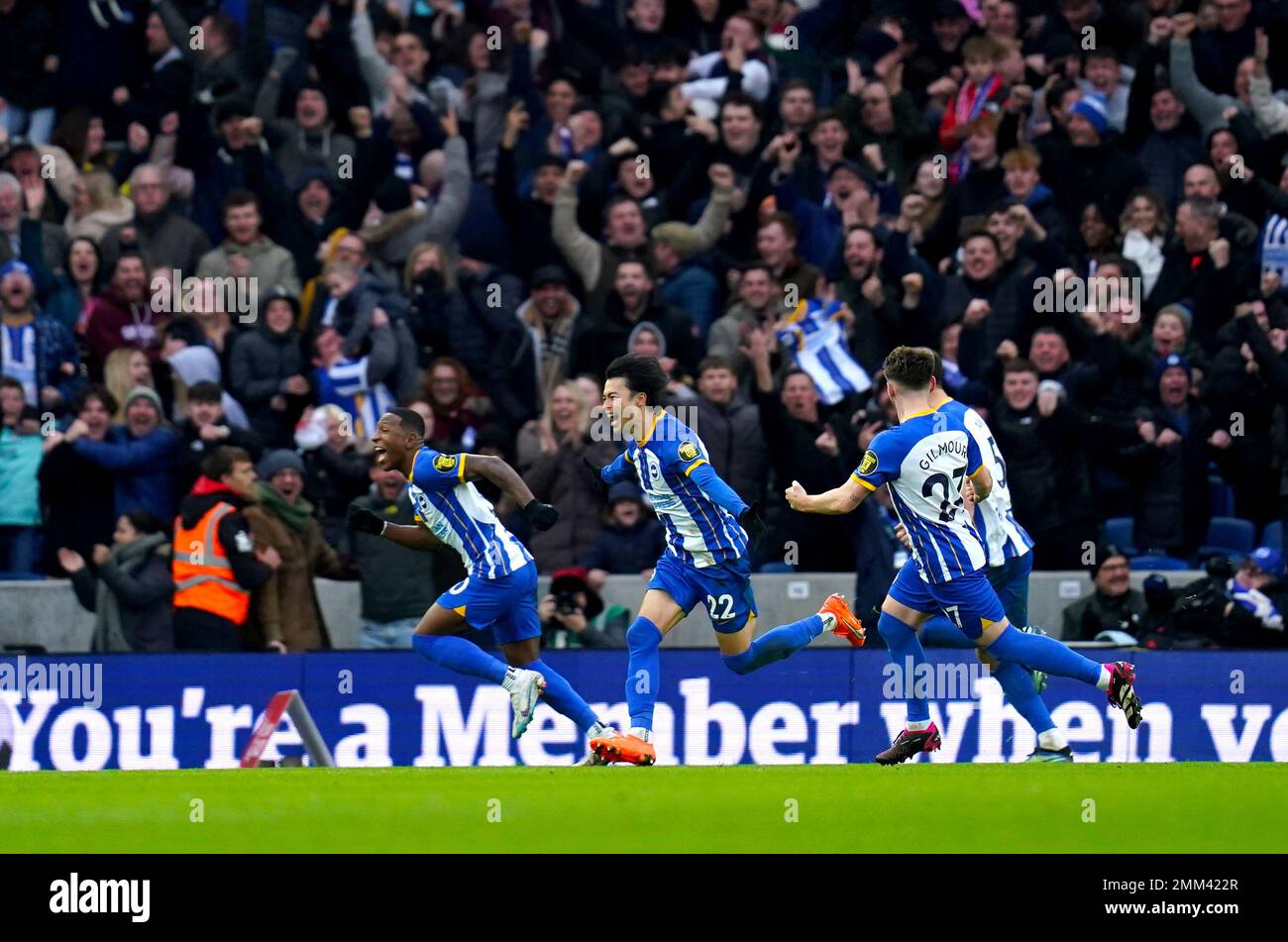 Brighton and Hove Albion's Kaoru Mitoma (centre) celebrates scoring ...