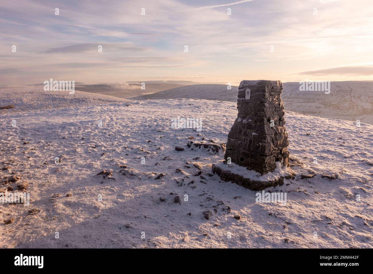 Snowy landscape from the summit plateau of Pen-y-ghent mountain in winter - one of the Yorkshire Three Peaks in the Yorkshire Dales National Park - wi Stock Photo