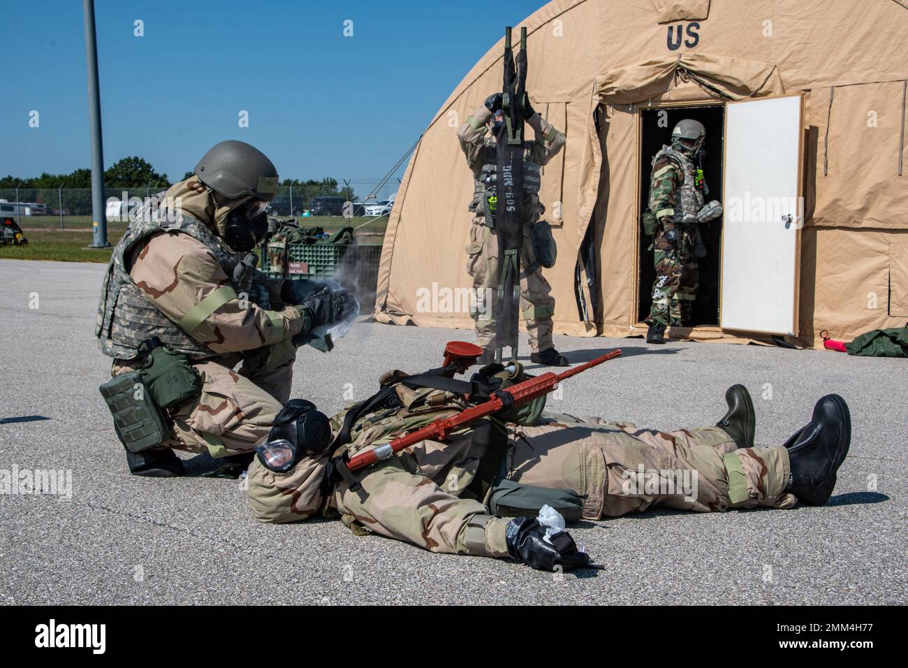 U.S. Air Force Airmen decontaminates a simulated casualty during a Chemical, Biological, Radiological, Nuclear exercise at Whiteman Air Force Base, Missouri, Sept. 14, 2022. Airmen train on how to treat CBRN related casualties to ensure mission readiness. Stock Photo