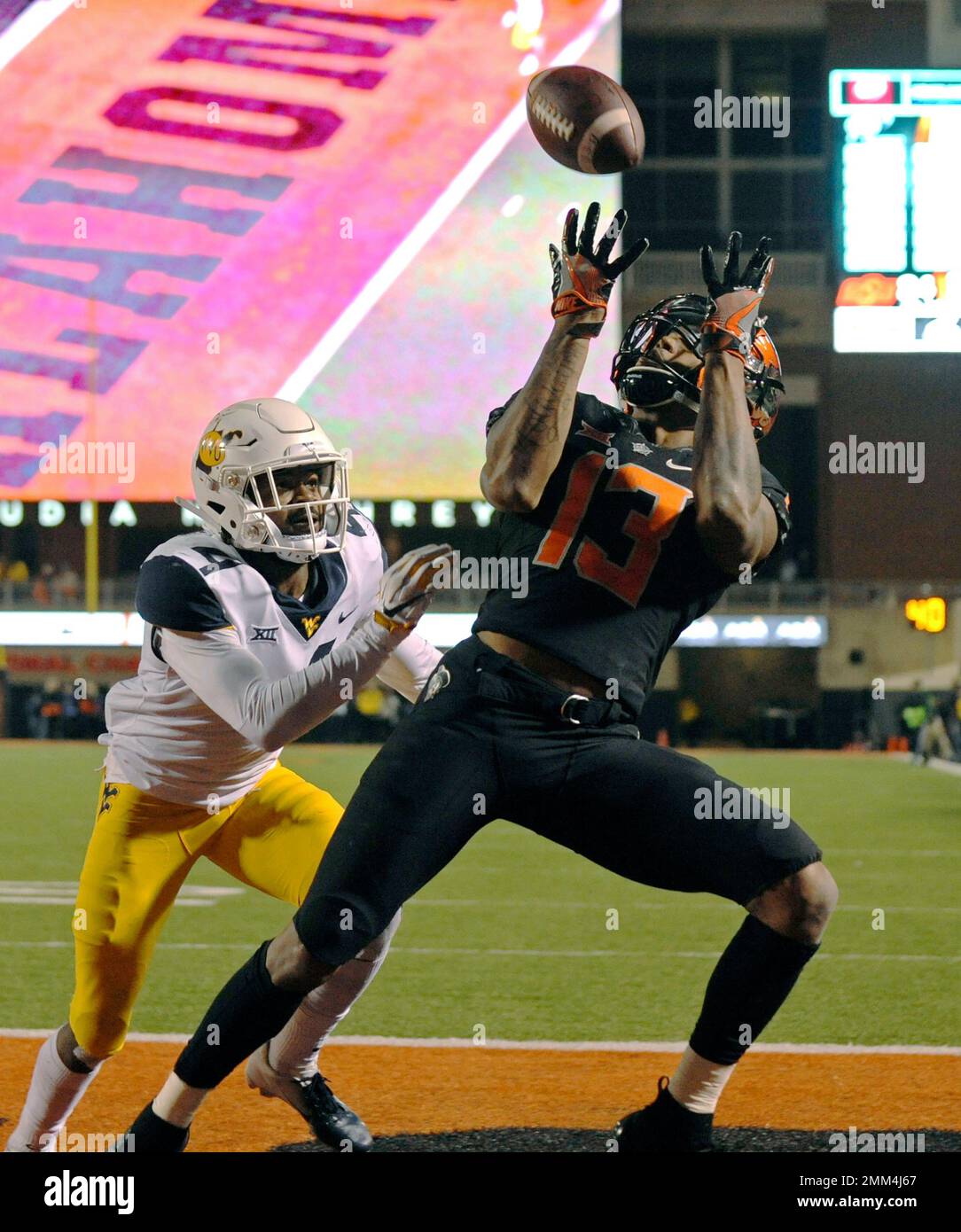 Oklahoma State wide receiver Tyron Johnson (13) catches a touchdown