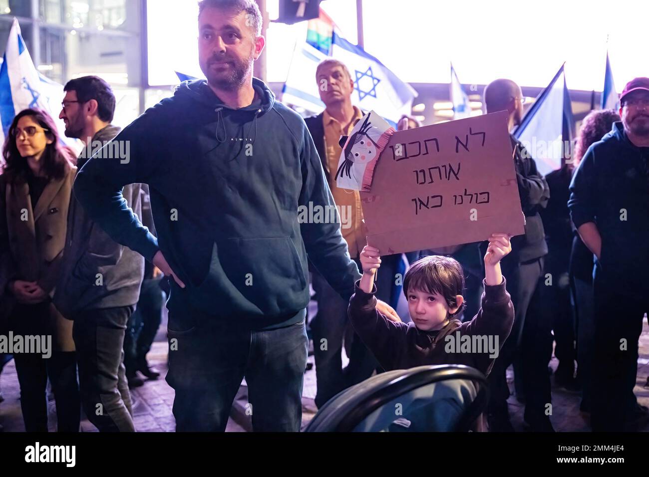 Tel Aviv, Israel. 28th Jan, 2023. A young boy holds a placard that states ìYou wont turn us off, weíre all hereî during the demonstration. Over 100,000 people protested in Tel Aviv against Netanyahu's far-right government and judicial overhaul, a day after two deadly terror attacks in Jerusalem. Credit: SOPA Images Limited/Alamy Live News Stock Photo