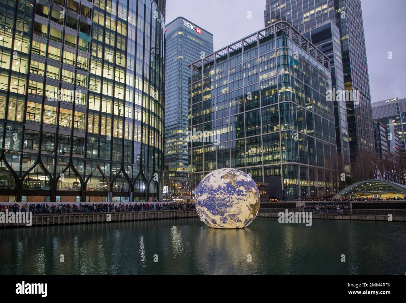 Crowds of people look at Winter Lights at Canary Wharf 2023 Floating