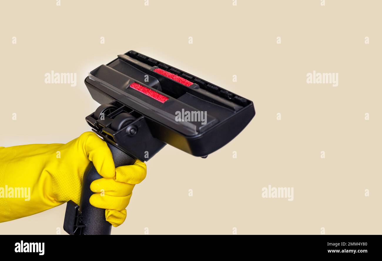 woman holding vacuum cleaner handle carpet floor brush isolated Stock