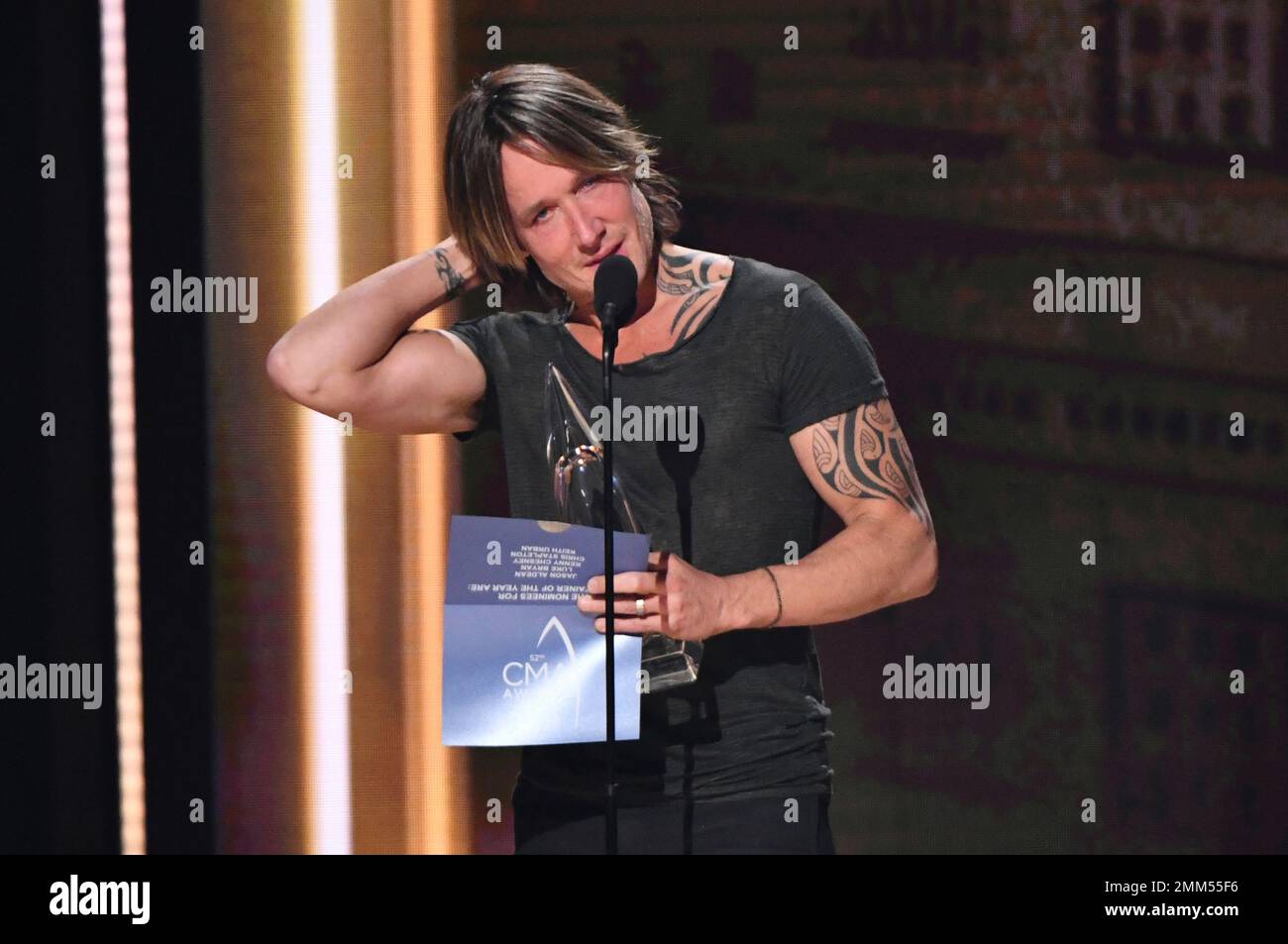 Keith Urban accepts the award for entertainer of the year at the 52nd