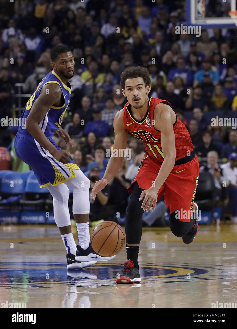 Atlanta Hawks guard Trae Young (11) dribbles past Golden State Warriors forward Alfonzo McKinnie