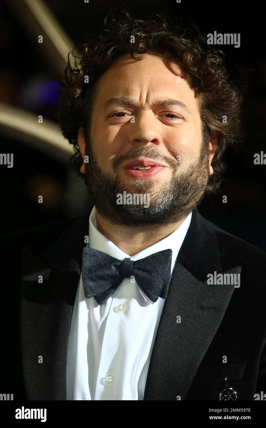 Actor Dan Fogler poses for photographers upon arrival at the premiere