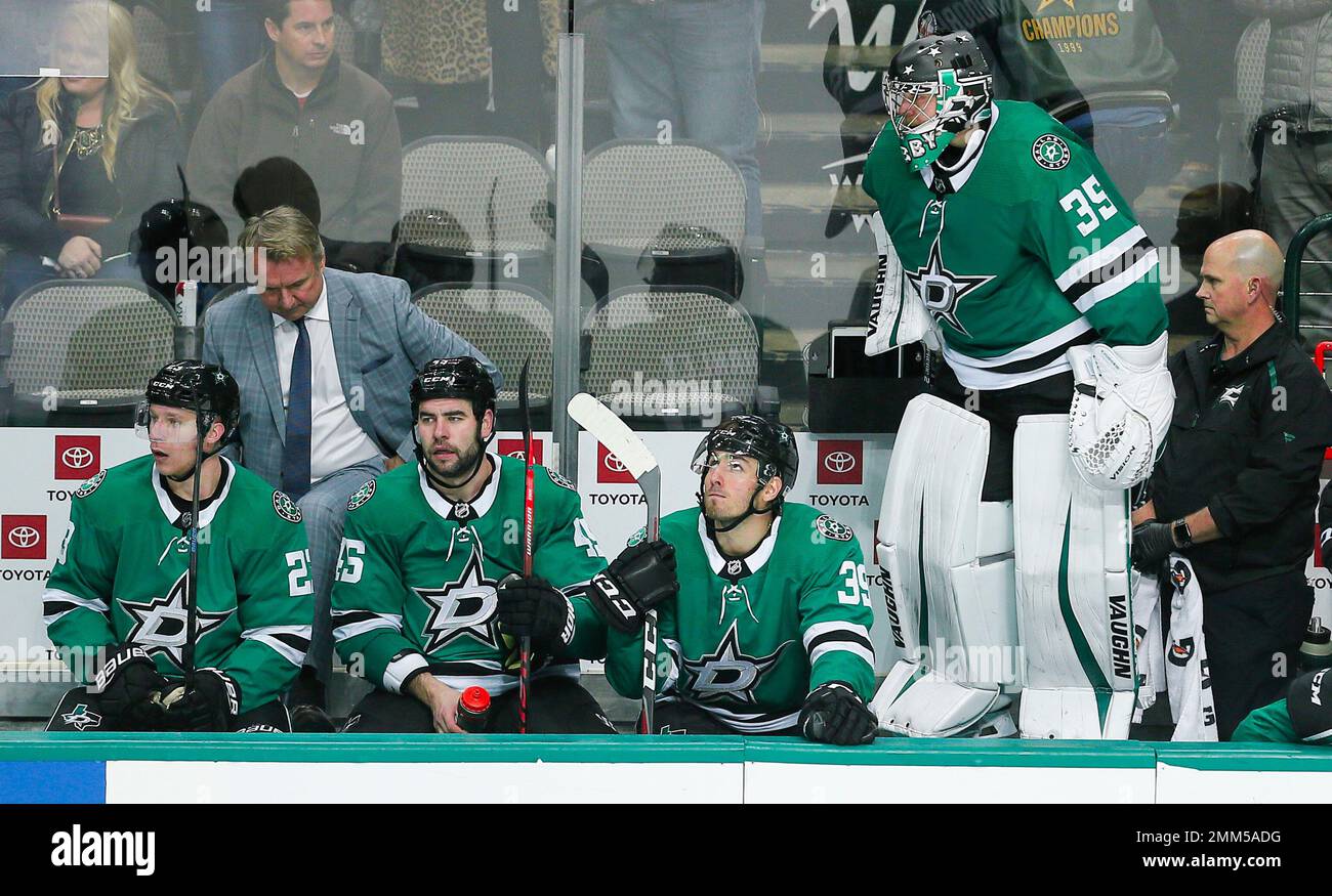 Dallas Stars goaltender Anton Khudobin (35) stands on the bench during the third period of an NHL hockey game against the Columbus Blue Jackets, Monday, Nov. 12, 2018, in Dallas. Columbus won 2-1. (AP Photo/Brandon Wade) Stock Photo