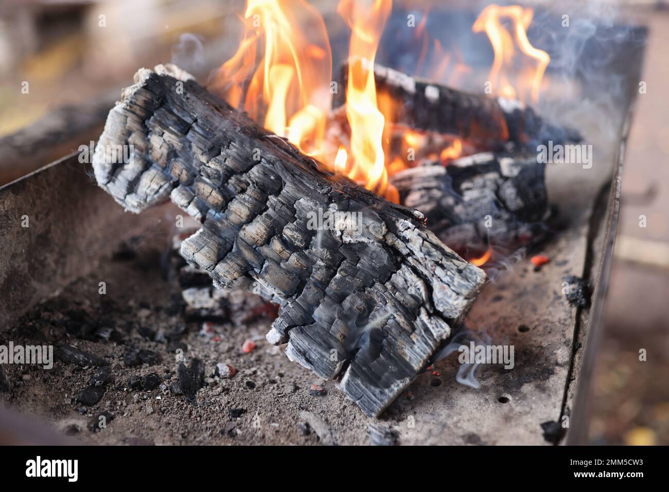 Close up of burning firewood outdoor. Stock Photo