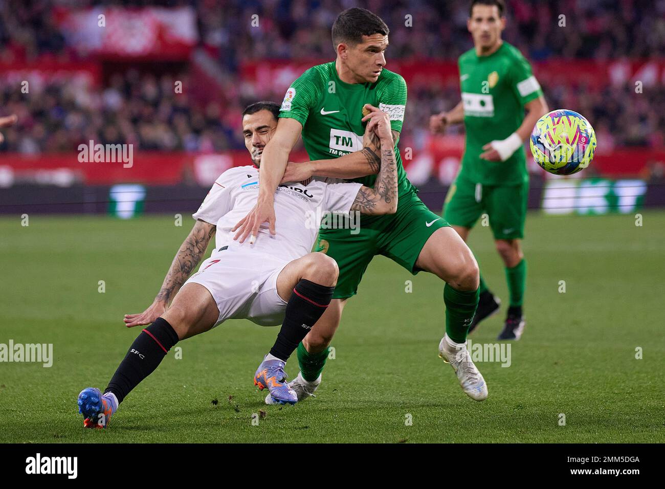 Seville, Spain. 28th Jan, 2023. Suso (7) of Sevilla FC and Lautaro Blanc (2) of Elche seen during the LaLiga Santander match between Sevilla FC and Elche at Estadio Ramon Sanchez Pizjuan in Seville. (Photo Credit: Gonzales Photo/Alamy Live News Stock Photo