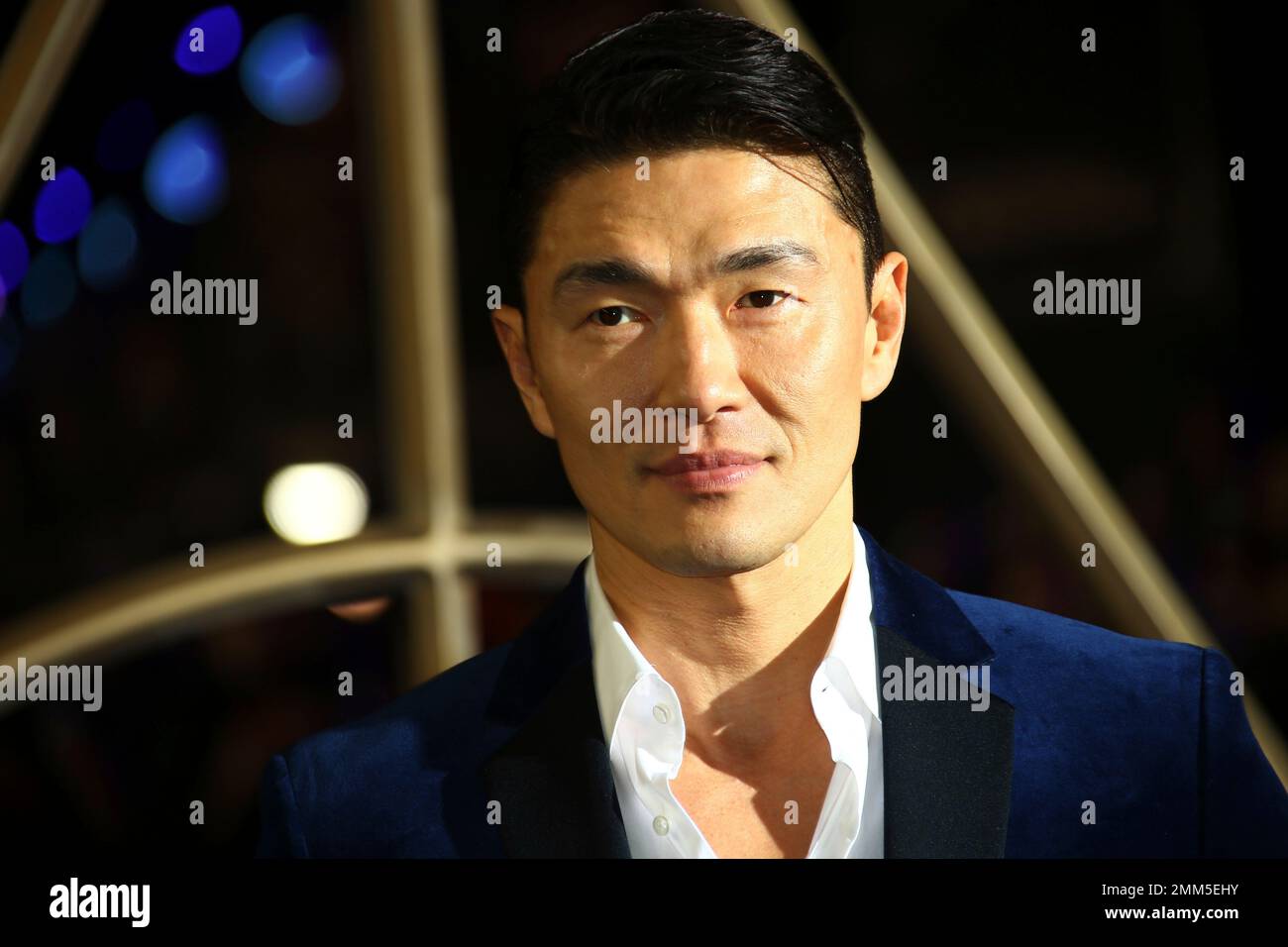 Actor Rick Yune poses for photographers upon arrival at the premiere of