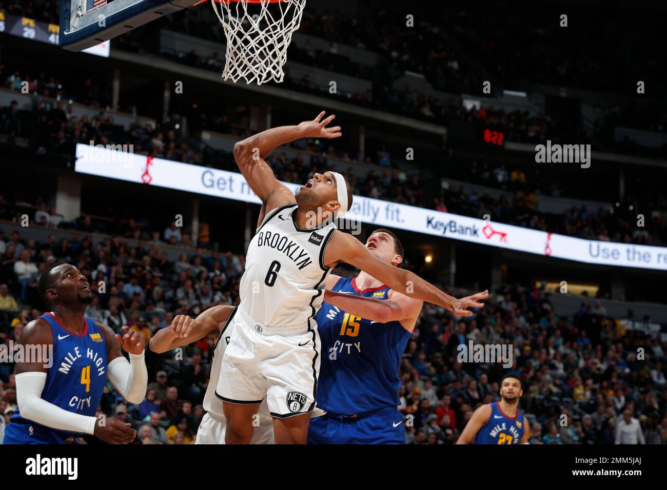 Philadelphia 76ers' Joel Embiid, center right, of Cameroon, puts up the  shot as he splits between Brooklyn Nets' Jared Dudley, center left, and  Jarrett Allen, right, during the second half in Game