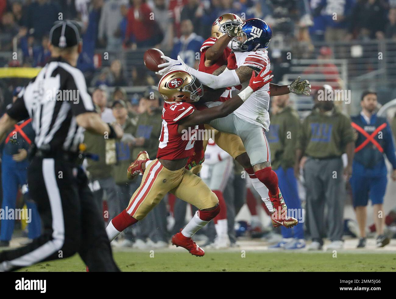 San Francisco 49ers cornerback Ahkello Witherspoon, top, and defensive back Jimmie Ward (20