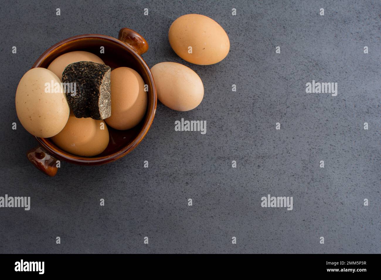 Truffled eggs with a tuber melanosporum winter truffle Stock Photo