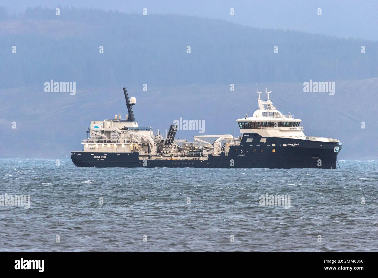State-of-the-art Ronja Star ship is a live fish transport vessel anchored here at sea in the evening on Loch Fyne, Scotland, UK waters Stock Photo