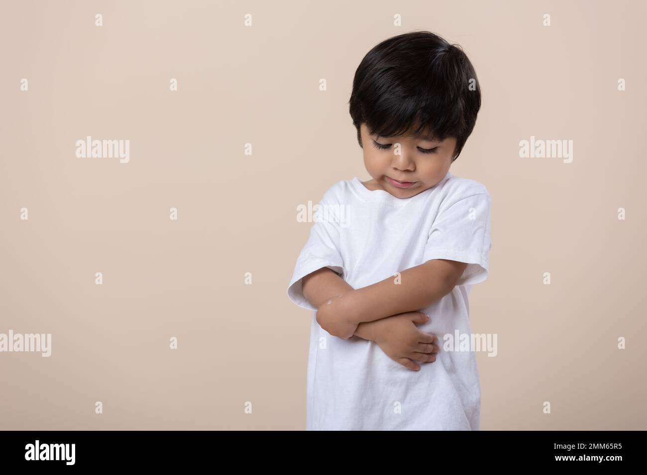 scolded or sad little Mexican boy, sad expression Stock Photo Alamy