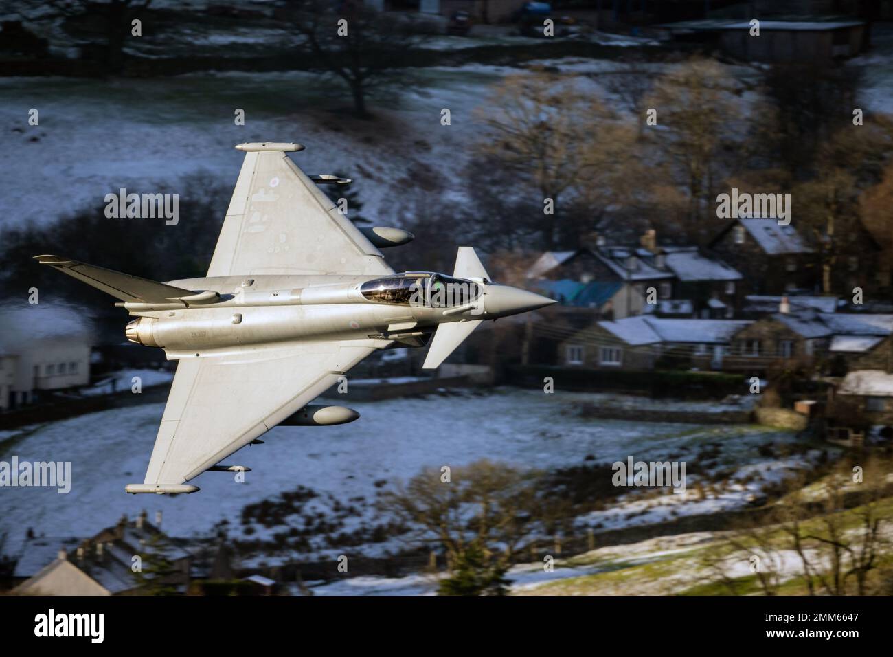 RAF Typhoon (Eurofighter) callsign 'Razor 021' on a low level training flight during winter in LFA17, at Ullswater in the Lake District Stock Photo