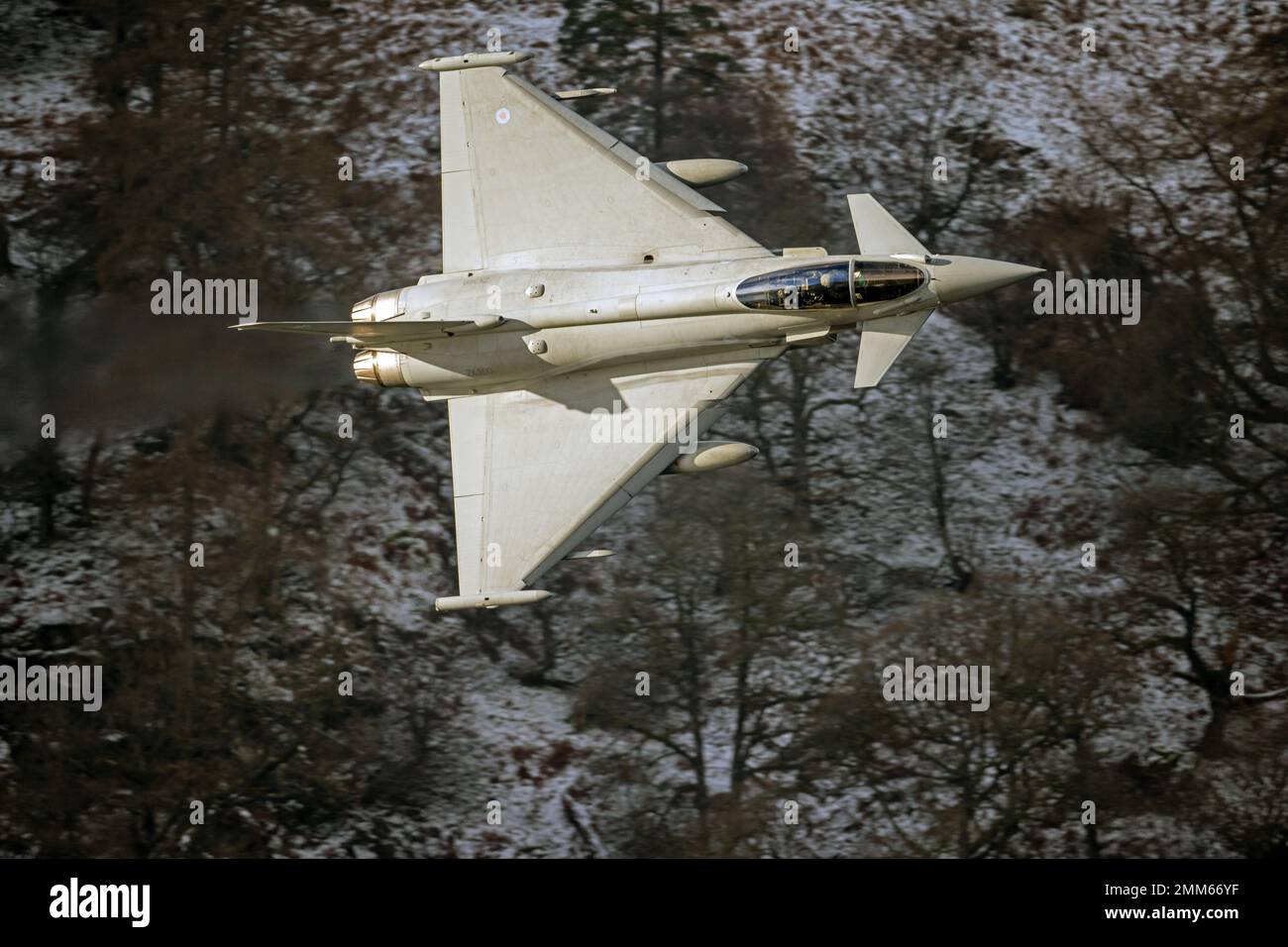 RAF Typhoon (Eurofighter) callsign 'Havoc' on a low level training flight during winter in LFA17, at Ullswater in the Lake District Stock Photo