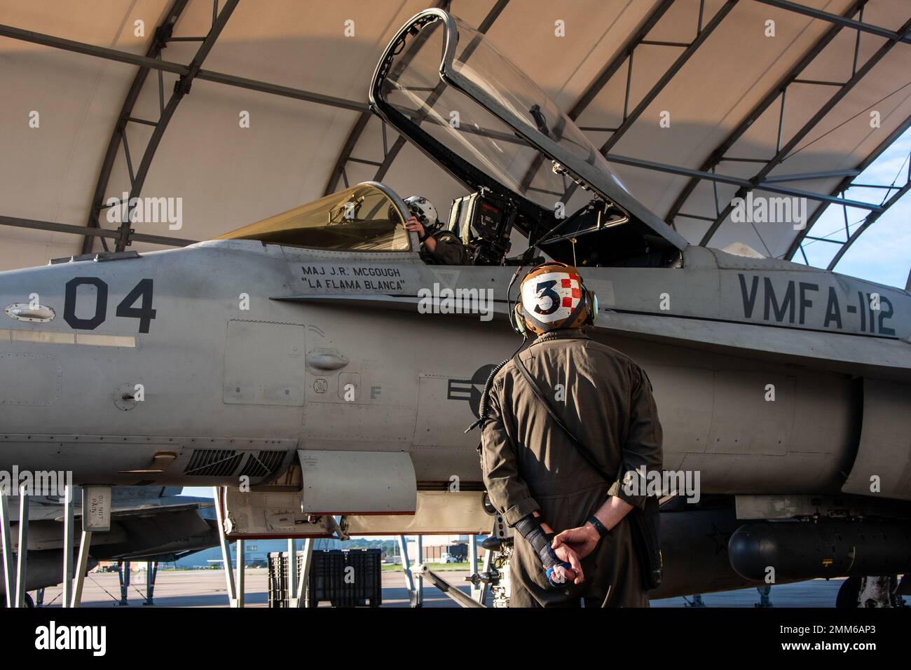 Marines attached to Marine Fighter Attack Squadron (VMFA) 112, Marine Aircraft Group 41, 4th Marine Aircraft Wing, conduct pre-flight checks on an F/A-18C Hornet at Naval Air Station Joint Reserve Base Fort Worth, Texas, Sept. 15, 2022. VMFA-112 is participating in a joint long-range strike exercise with Marine Aerial Refueler Transport Squadron (VMGR) 234, VMFA-225, Marine Fighter Training Squadron (VMFT) 401 and U.S. Air Force 513th Operations Support Squadron. This large force exercise demonstrates MAG-41's ability to project long-range strike capability and integrate with the Marine Corps' Stock Photo