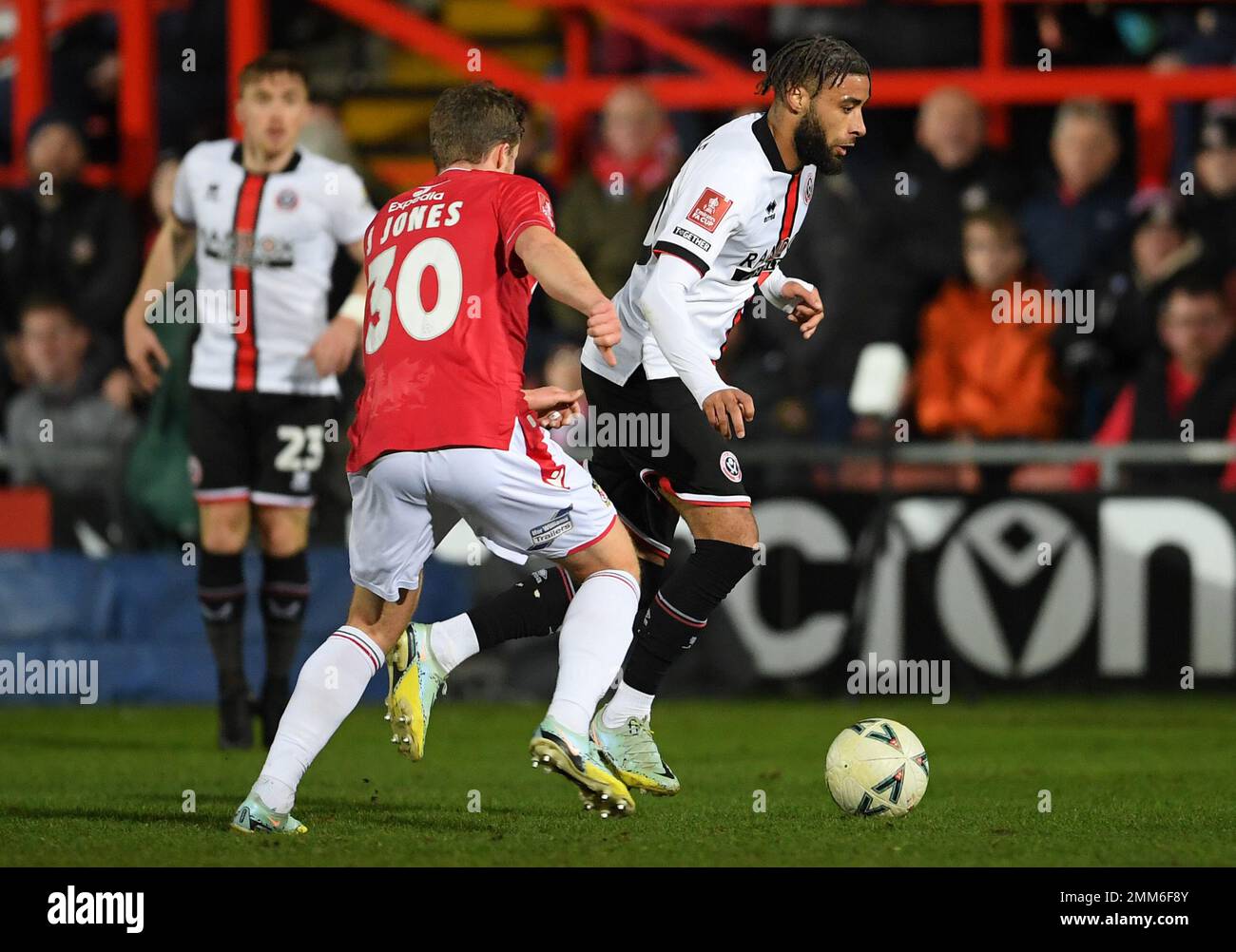 Wrexham, UK. 29th Jan, 2023. Jayden Bogle of Sheffield Utd gets past James Jones of Wrexham during the The FA Cup match at the Racecourse Stadium, Wrexham. Picture credit should read: Gary Oakley/Sportimage Credit: Sportimage/Alamy Live News Stock Photo