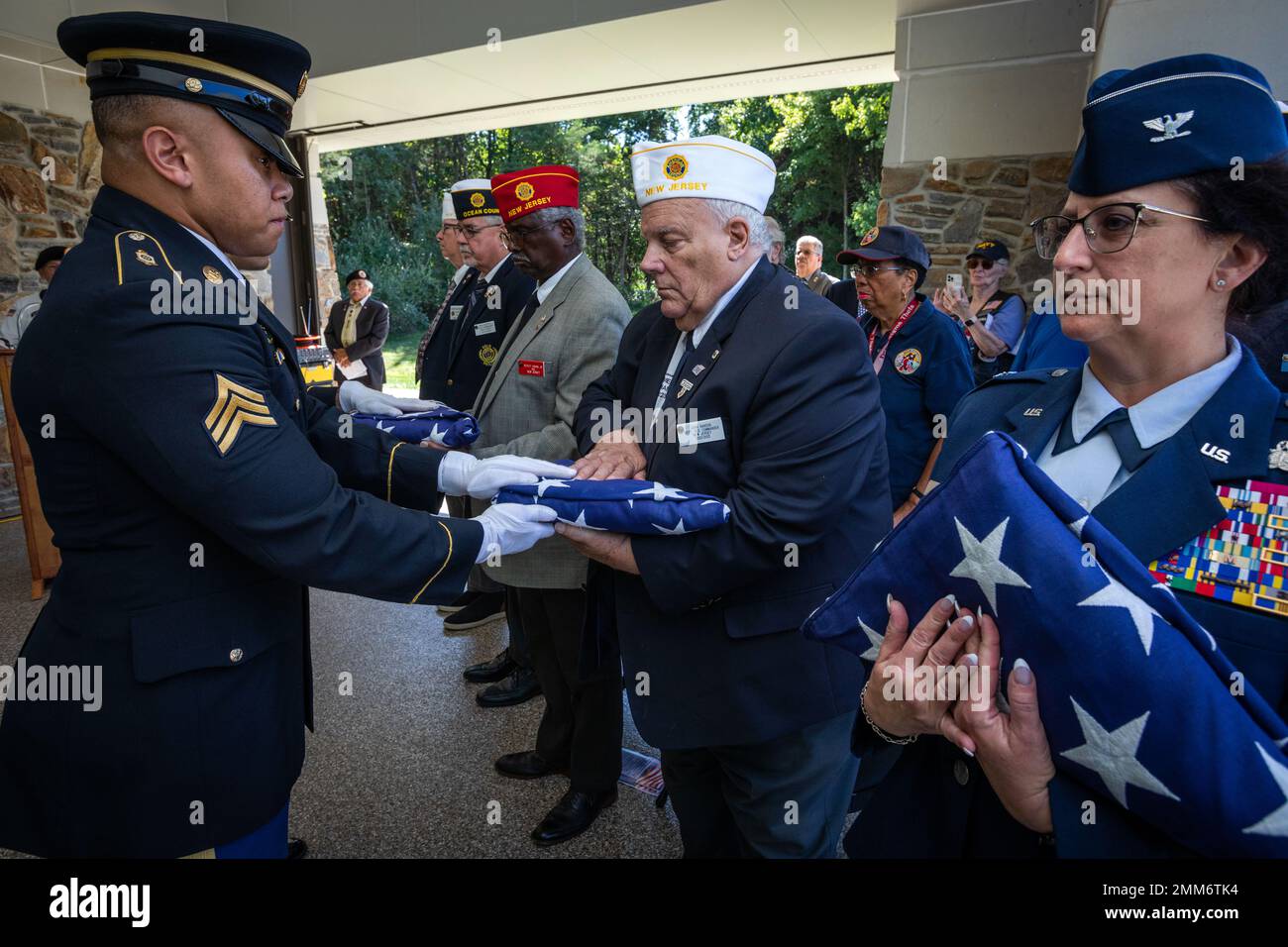 U.S. Army Sgt. Bless E. Sherrill, left, Headquarters and Headquarters