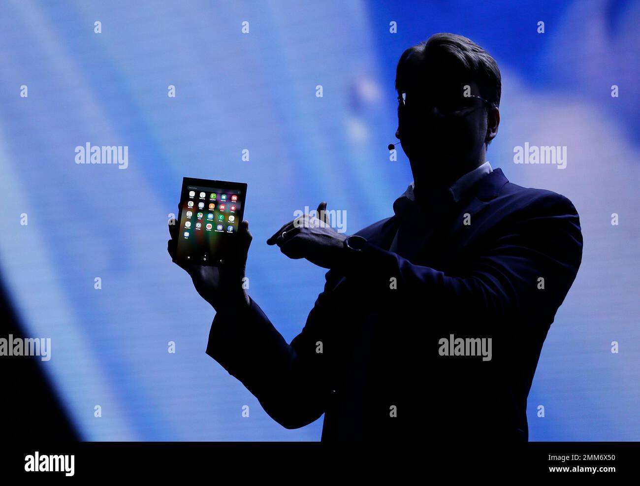 Justin Denison, SVP of Mobile Product Development, shows off the Infinity  Flex Display of a folding smartphone during the keynote address of the  Samsung Developer Conference Wednesday, Nov. 7, 2018, in San