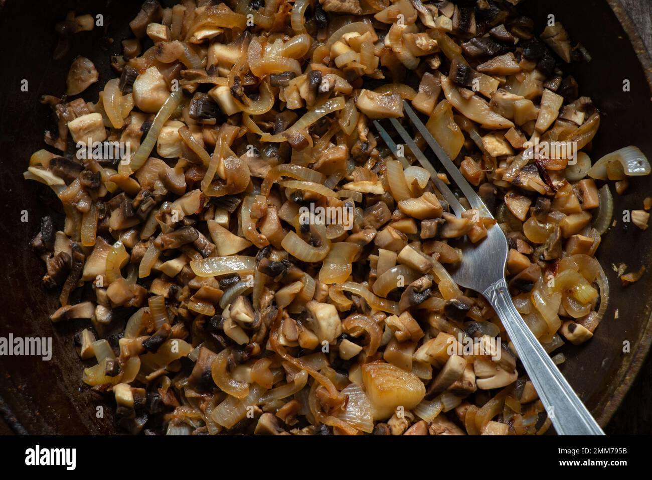 fried mushrooms in pans on a table in the kitchen on a table Stock