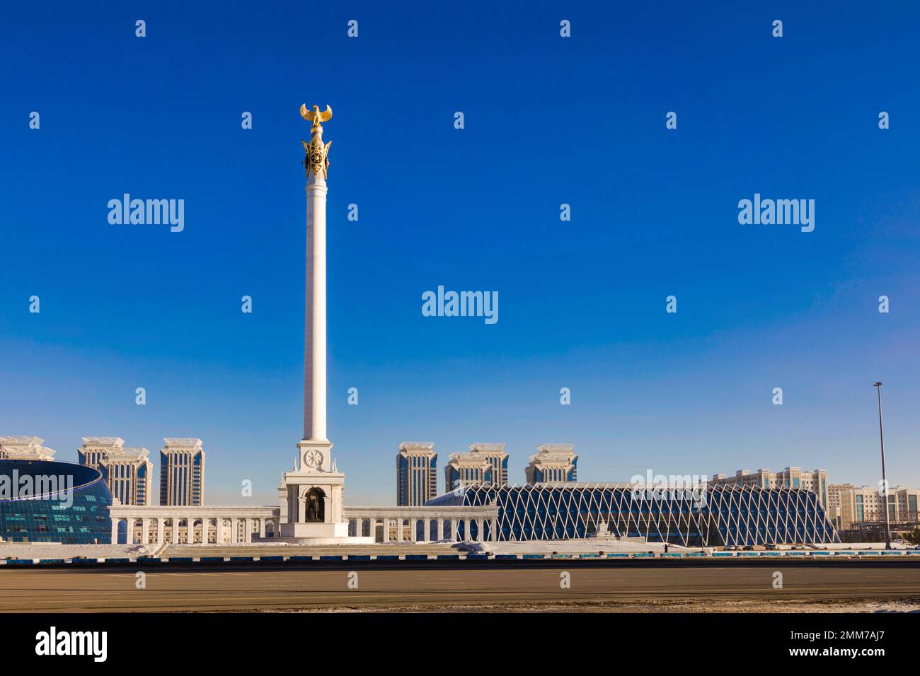 Kazakh Eli (The Country of Kazakhs) monument on Independence Square in Astana Kazakhstan with Palace of Independence seen in background Stock Photo
