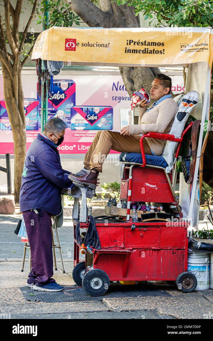 Mexico City,Avenida Paseo de la Reforma,shoeshine service,man men male,adult adults,resident residents,sign signs information billboard,promoting prom Stock Photo