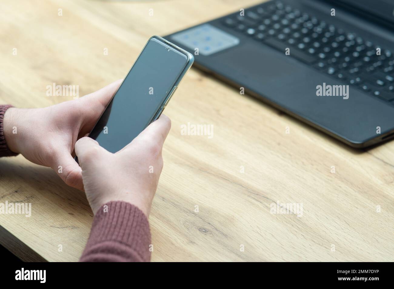 Man hands holding smartphone. Man using smartphone and pointing on the screen with one finger Stock Photo
