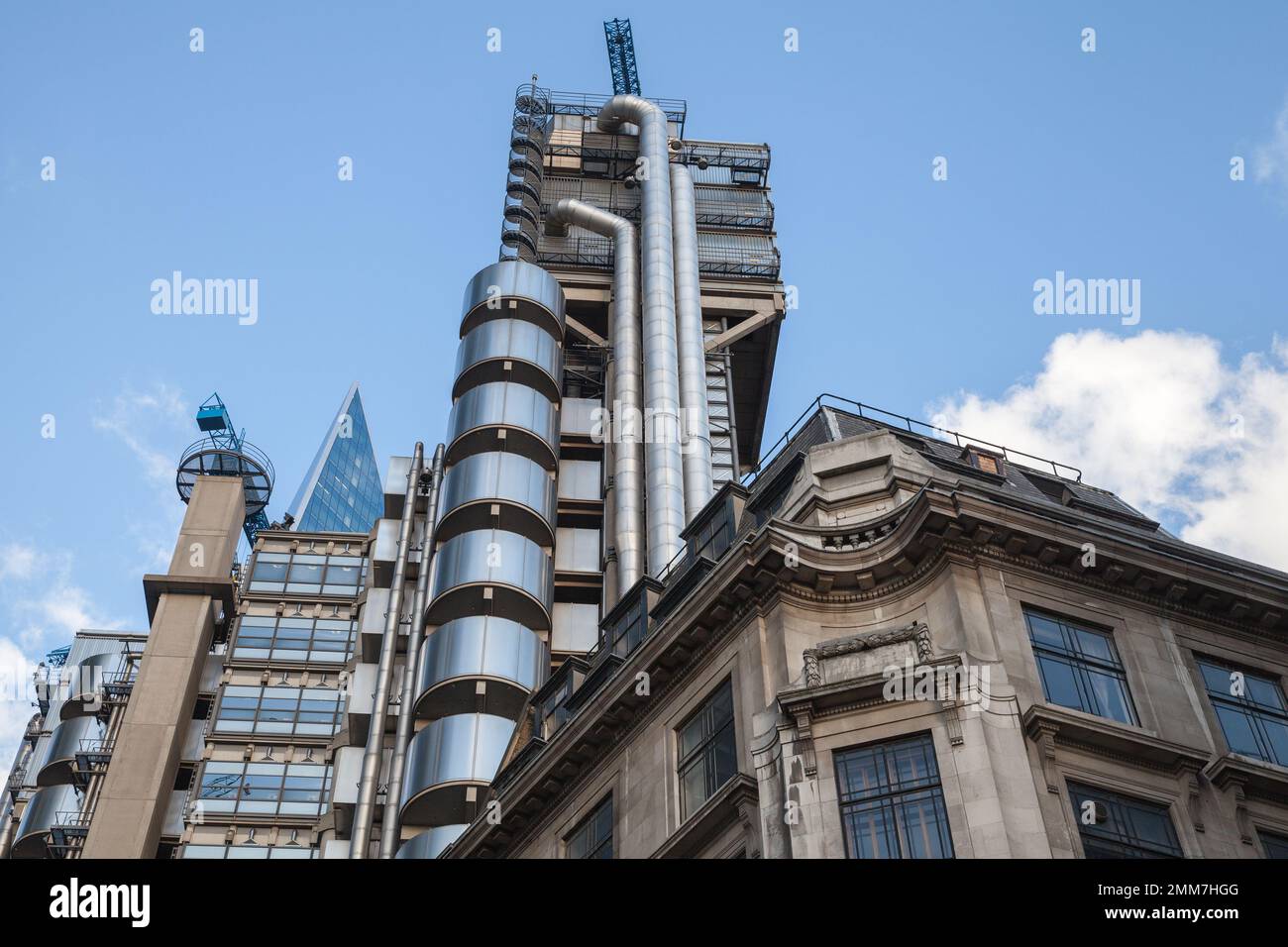 London, UK - April 25, 2019: Street view with the Lloyds building or Inside-Out Building. It is located on the former site of East India House in Lime Stock Photo
